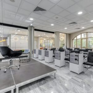 Spacious conference room with podium, chairs, and glass partitions featuring modern design elements.